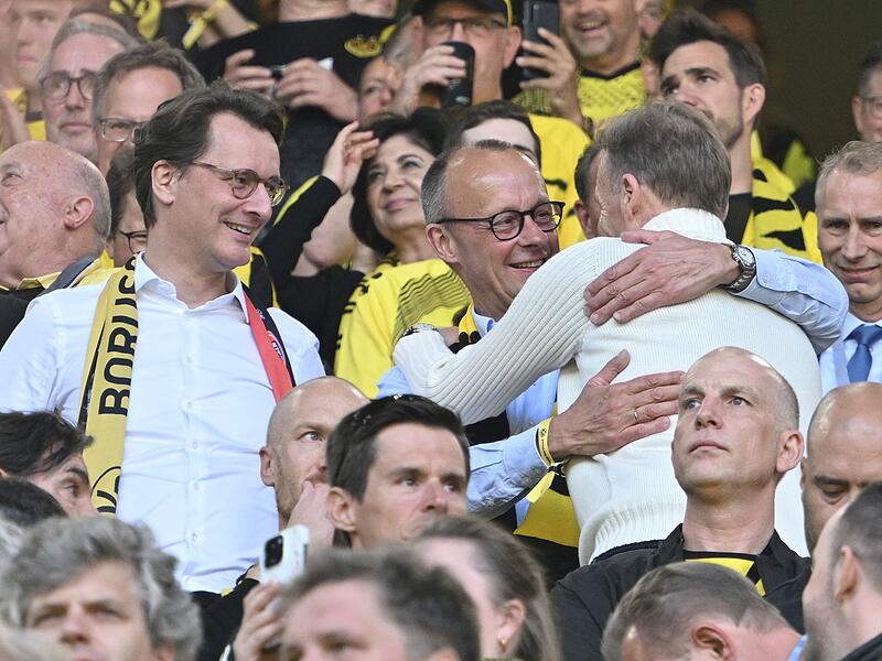 Friedrich Merz (Mitte) und Hans-Joachim Watzke