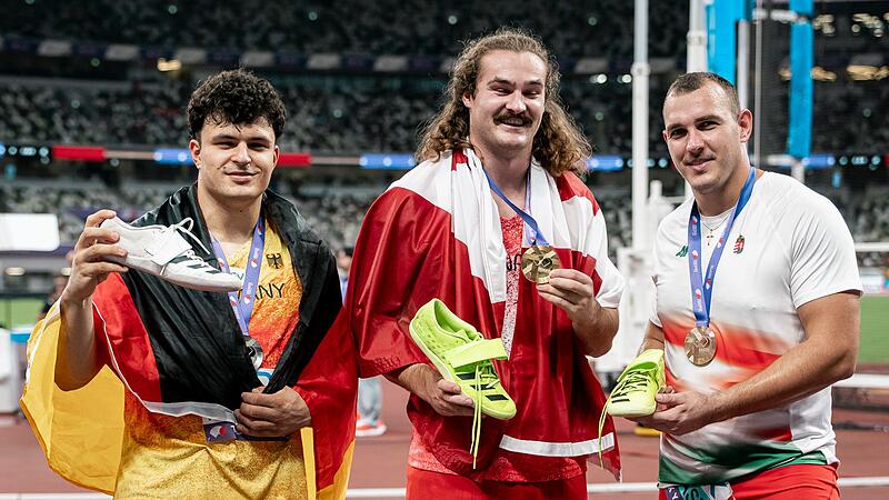 Die drei Medaillengewinner bei der WM im Hammerwerfen: von links Merlin Hummel  (2.), Sieger Ethan Katzberg und Bence Halasz (3.).