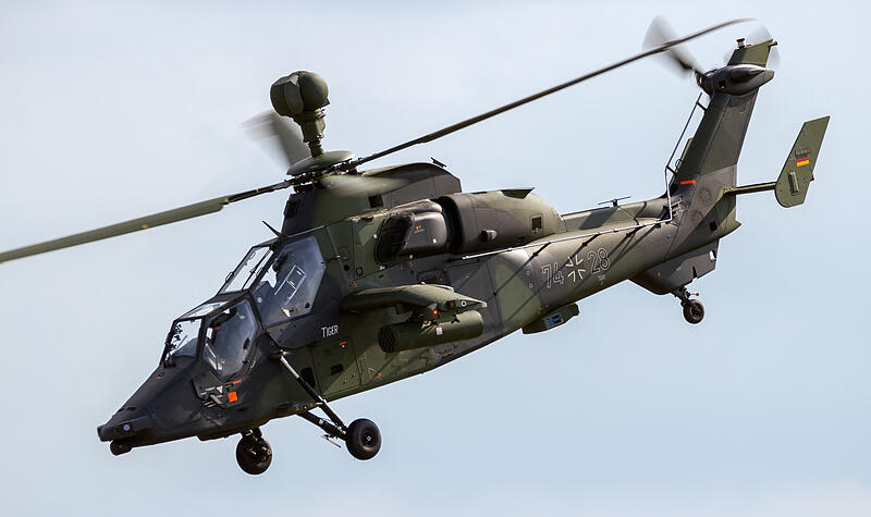 German Army Eurocopter EC665 Tiger attack helicopter flyby during the Berlin Airshow ILA at Berlin-Schoneveld airport. BERLIN - JUN 2, 2016. German Army Eurocopter EC665 Tiger attack helicopter flyby during the Berlin Airshow ILA at Berlin-Schoneveld airport. BERLIN - JUN 2, 2016.