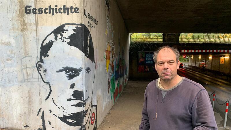 Der Sprayer und Aktionsk&uuml;nstler Alex hatte im Oktober an einer Unterf&uuml;hrung in Coburg ein besonderes Wandbild angebracht: Es zeigt je eine Gesichtsh&auml;lfte von Hitler und von Putin &ndash; und dar&uuml;ber die Frage: &bdquo;Geschichte wiederholt sich?!&ldquo;