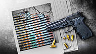 Hand gun banner or panorama pfoto on dark stone table top view.