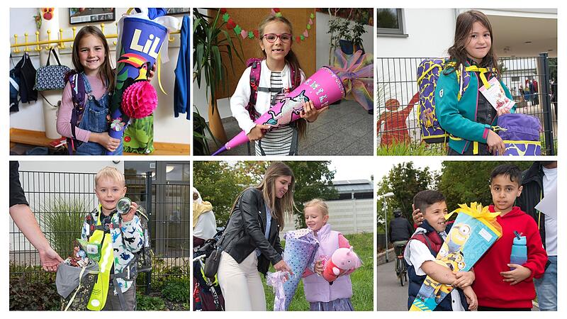 Kinder zeigen ihre Schultüten