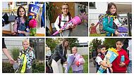 Kinder zeigen ihre Schultüten