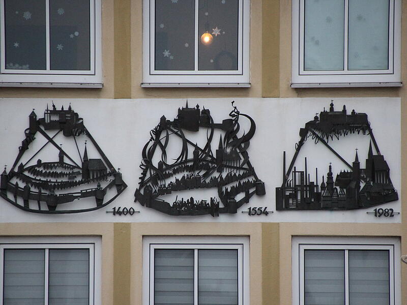 Die drei Kupfervignetten am EKU-Platz