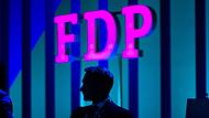 Christian Lindner, FDP-Bundesvorsitzender und Bundesfinanzminister, sitzt beim FDP-Bundesparteitag auf der B&uuml;hne.