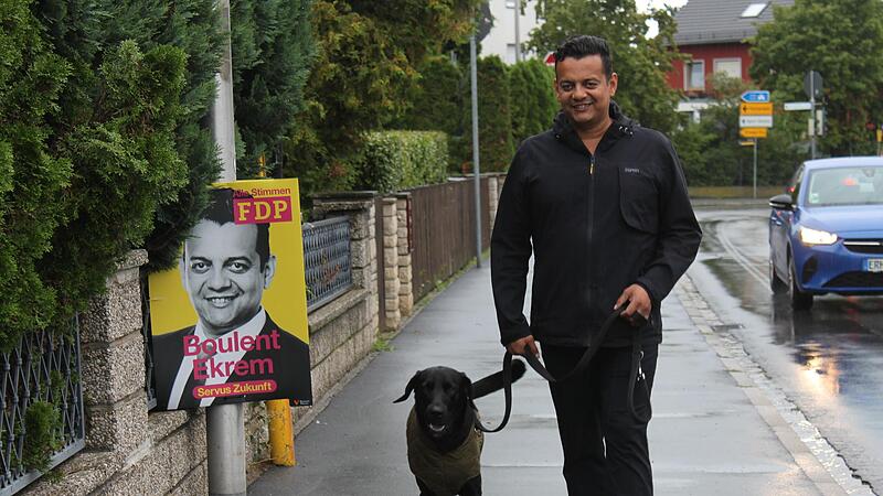 Boulent Ekrem geht mit seinem Hund Pascha am INA-Ring in Herzogenaurach Gassi.