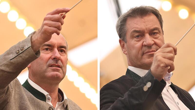 Hubert Aiwanger, FW-Vorsitzender (l.), und Markus Söder, bayerischer Ministerpräsident (CSU), dirigieren die Stadtkapelle beim Handwerkertag auf der Michaelismesse. Die beiden Politiker kamen zeitversetzt. Am Dienstag muss Aiwanger zum Rapport bei...
