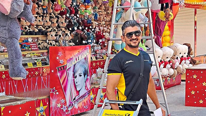 Zusteller Mamed Aga liefert seine Pakete auch am Schützenfest aus. Für seinen Job braucht er eine gute körperliche Verfassung.Jochen Hümmrich-Welt Zusteller Mamed Aga liefert seine Pakete auch am Schützenfest aus. Für seinen Job braucht er eine gute körperliche Verfassung.Jochen Hümmrich-Welt