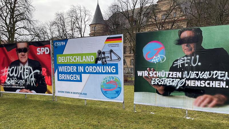 Beschmierte Wahlplakate am Wilhelmsplatz Beschmierte Wahlplakate am Wilhelmsplatz